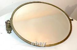 Large antique industrial style brass pivoting vanity oval beveled wall mirror