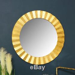 Large round gold wall mirror vintage chic luxe living room hallway ornate framed