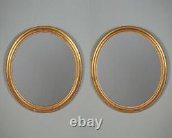 Pair of Large Gilded Oval Wall Mirrors c. 1890