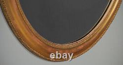 Pair of Large Gilded Oval Wall Mirrors c. 1890