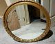 Vintage large round gold ornate floral with leave hanging wall mirror